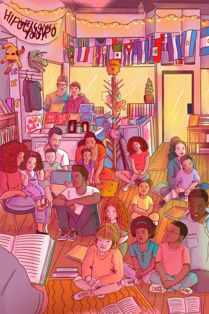 Illustration of a diverse group of children and young people sitting cn the floor of a bookshop, listening to a reading. The shop hangs multiple flags from various countries on its back wall. Illustration by Fanesha Fabre.